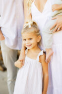 little girl holding her mom's hand